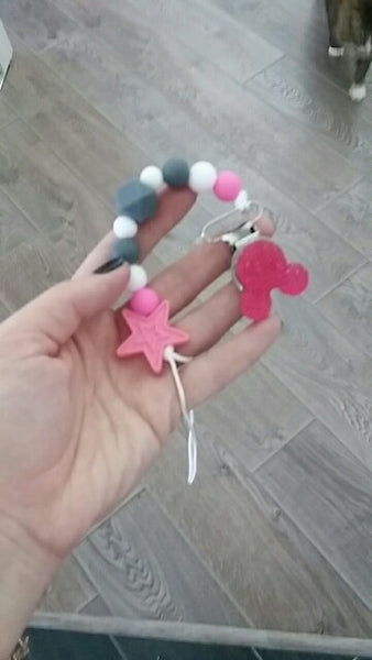 YOU FINALLY FOUND IT! a teething pacifier holder that is trendy, modern and safe for your baby