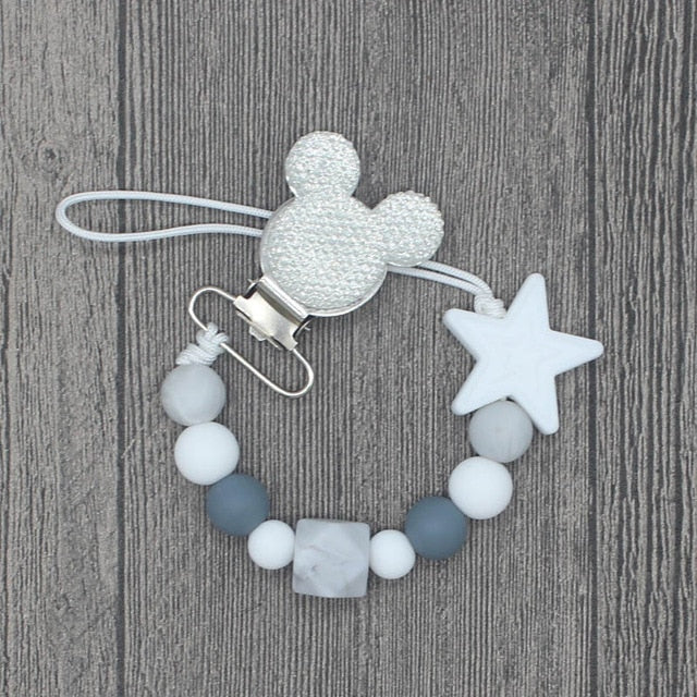 YOU FINALLY FOUND IT! a teething pacifier holder that is trendy, modern and safe for your baby