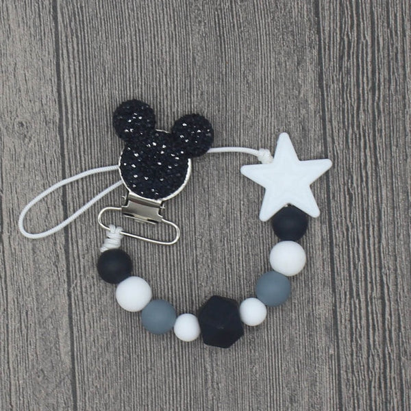 YOU FINALLY FOUND IT! a teething pacifier holder that is trendy, modern and safe for your baby